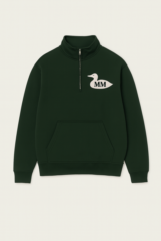 Dark green half-zip sweatshirt with a logo on a light beige background